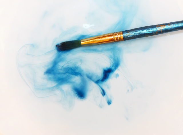 Brush closeup dip with watercolor paint